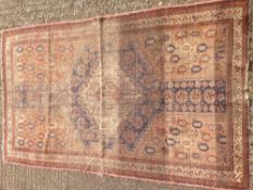 A 19th century wool rug The midnight field enclosing a central medallion within rosettes,