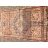 A 19th century wool rug The midnight field enclosing a central medallion within rosettes,