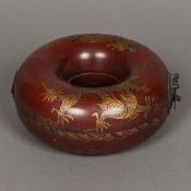 A Chinese red lacquered box and cover Of Torus form and decorated with gilt dragons.