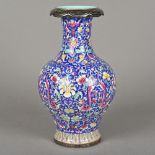 A Chinese porcelain vase With a blue ground and decorated in the round with colourful floral