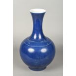 A Chinese porcelain vase With allover blue glaze, blue painted six character Kangxi mark to base.