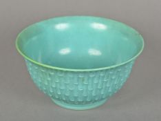 A Chinese turquoise ground porcelain bowl The exterior with faux bamboo decoration,