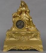 A French Empire ormolu cased mantle clock The silvered dial with Roman numerals and bell striking