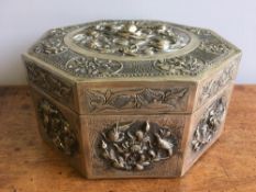 A Chinese white metal (tests as silver) box and cover Of octagonal section and decorated with