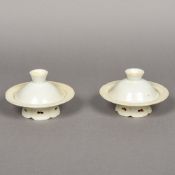 A pair of Chinese porcelain cups with stand Each with lappet moulding and pierced foot. 8.