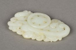A Chinese carved celadon jade group Worked with stylised phoenixes flanking a spoked wheel. 8.