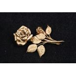 A 9 ct gold brooch Formed as a rose. 5.5 cm high.