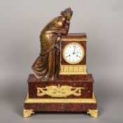 An early 19th century French ormolu and bronze mounted rouge griotte marble figural mantel clock by