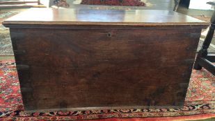 A 19th century padouk trunk The moulded hinged rectangular top with interior cast brass hinges,