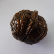 A Canton carved walnut Decorated in the round with various figures.