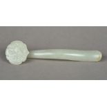 A Chinese carved celadon jade ruyi sceptre Of typical form. 14.5 cm long.