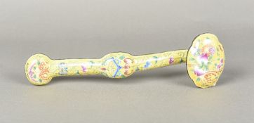 A Canton enamel ruyi sceptre Of typical form, decorated with flowers and bat on a yellow ground.