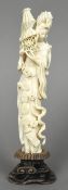 A late 19th/early 20th century Chinese carved ivory figure of Guanyin Typically worked upturning a
