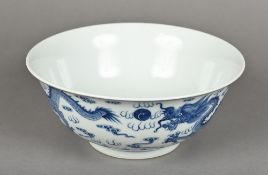 A late 19th century Chinese blue and white porcelain bowl Finely painted with dragons chasing