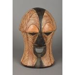 A Luba carved and polychrome decorated Kifwebe mask With stylised features. 33.5 cm high.