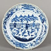 A Chinese porcelain blue and white dish Centred with a figure on horseback and attendants. 29.