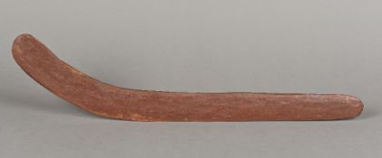 A painted wooden boomerang,