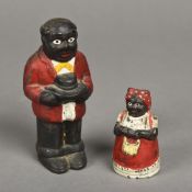 Two American cast iron money banks formed as Aunt Jemima and Uncle Moses Typically modelled.
