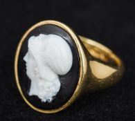 An 18 ct gold agate cameo set ring, hallmarked for 1912, the cameo earlier 2 cm high.