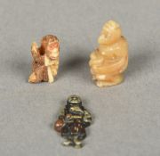 A Japanese carved ivory toggle Worked as a monkey; together with another,