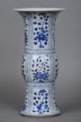 A Chinese blue and white porcelain gu vase Decorated with floral sprays,