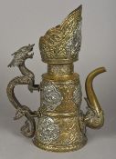 A 19th century Tibetan white metal mounted brass ewer The spout issuing from a mythical beast mask,