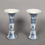 A pair of Chinese blue and white porcelain gu vases Each of typical form decorated with mythical