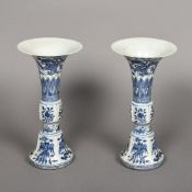 A pair of Chinese blue and white porcelain gu vases Each of typical form decorated with mythical