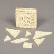 A 19th century Chinese Canton carved ivory Tangram box Each piece typically carved.