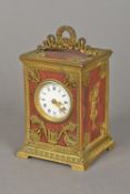 A 19th century French variegated rouge marble mounted carriage clock The laurel wreath and bow tied