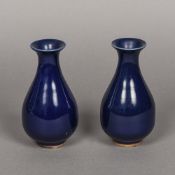 A pair of Chinese porcelain baluster vases Both with allover blue glaze. 15 cm high.