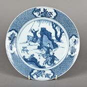 A Chinese blue and white porcelain plate Decorated with a deer hunting scene,
