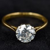 An 18 ct gold diamond solitaire ring The claw set stone approximately 1.75 carats.