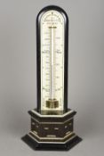 A 19th century ivory and ebony table thermometer With ivory mounted stepped plinth base,