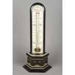 A 19th century ivory and ebony table thermometer With ivory mounted stepped plinth base,