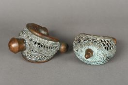 Two Benin cast and pierced bronze bracelets Of typical form. The largest 14 cm wide.