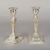 A pair of Edwardian Adam style silver candlesticks, hallmarked Sheffield 1901,