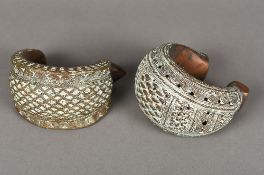 Two Benin cast and pierced bronze bracelets Of typical form. The largest 14.5 cm wide.