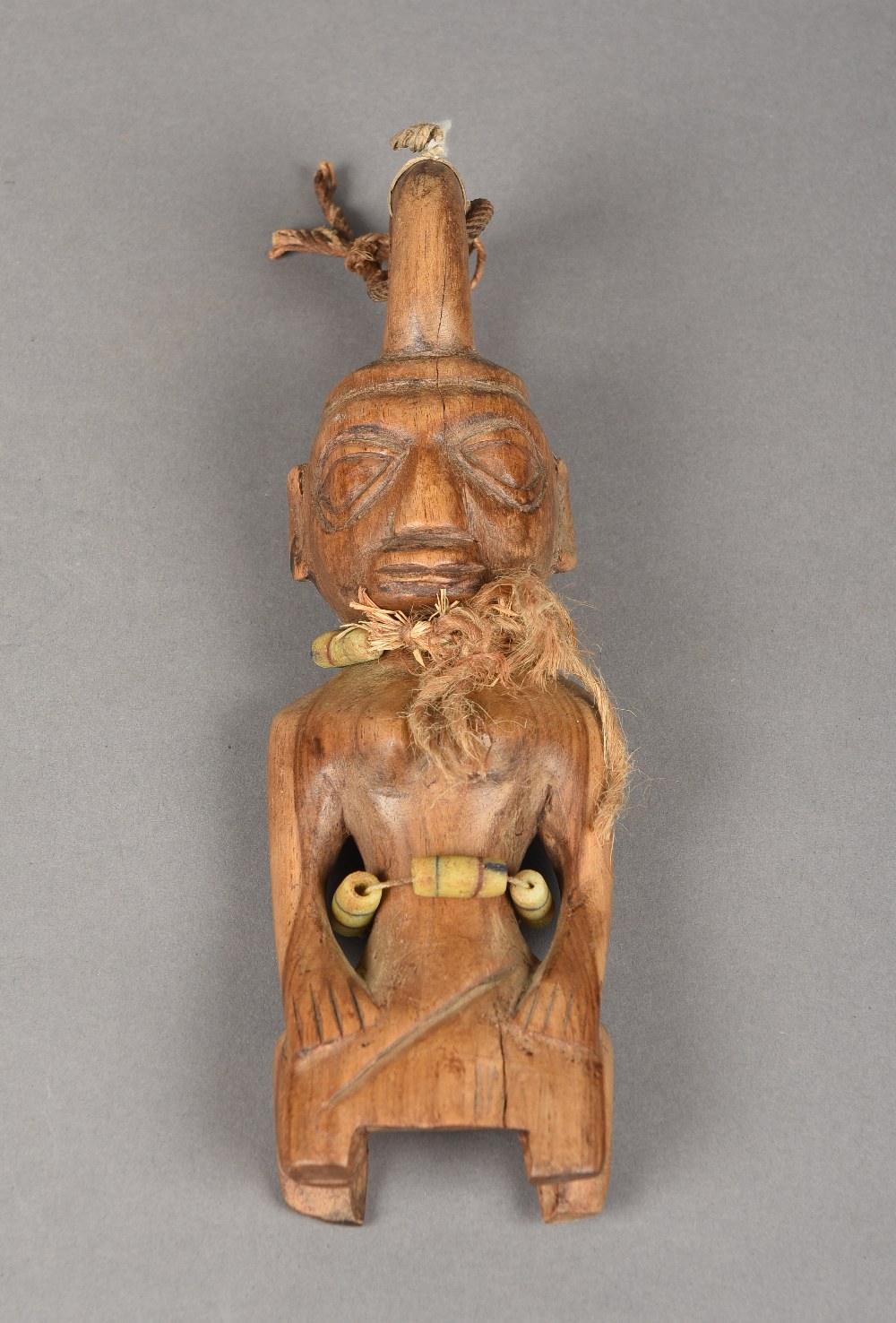 An African carved wood Yoruba tribe Ibeji figure Typically worked with beaded decoration.