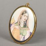 An Indian miniature portrait on ivory Depicting a bejewelled young lady, framed and glazed. 6.