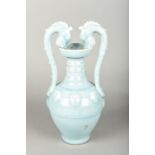 A Chinese porcelain twin handled vase The ribbed body with applied roundels,