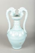 A Chinese porcelain twin handled vase The ribbed body with applied roundels,