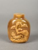 A Chinese carved agate snuff bottle Worked with a temple lion beneath a pine tree. 7.5 cm high.