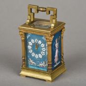 A 19th century enamel decorated miniature carriage clock The angular handle above the blue