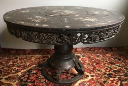 A Chinese mother-of-pearl inlaid hardwood centre table The segmented top inlaid with birds amongst