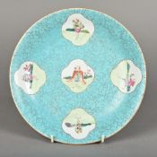 A Chinese porcelain dish Decorated with European figural vignettes on a simulated hardstone
