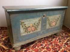 A 19th century painted pine trunk The hinged rounded rectangular top above the main body painted