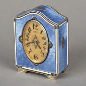 A Gubelin enamel decorated silver striking desk clock The arched top above the oval dial with