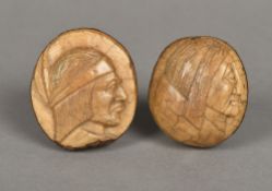 Two carved coquilla nuts Each decorated with a Red Indian bust. The largest 6.5 cm high.