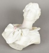 A white marble bust Carved as a young woman wearing a bow tied dress,